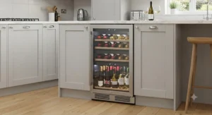 A compact professional wine fridge fitted neatly under a kitchen counter