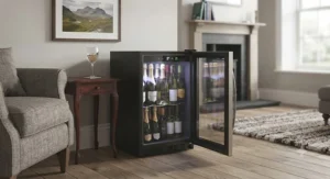 Mini wine cooler fully stocked with chilled bottles of Prosecco and white wine for weekend entertaining