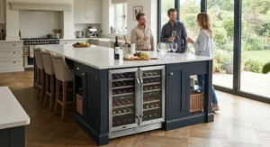 An under-counter built-in wine fridge installed within a large kitchen island, perfect for entertaining guests.