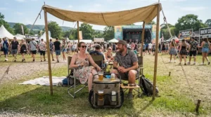 A sturdy insulated wine carrier for 2 bottles set up at an outdoor music festival.